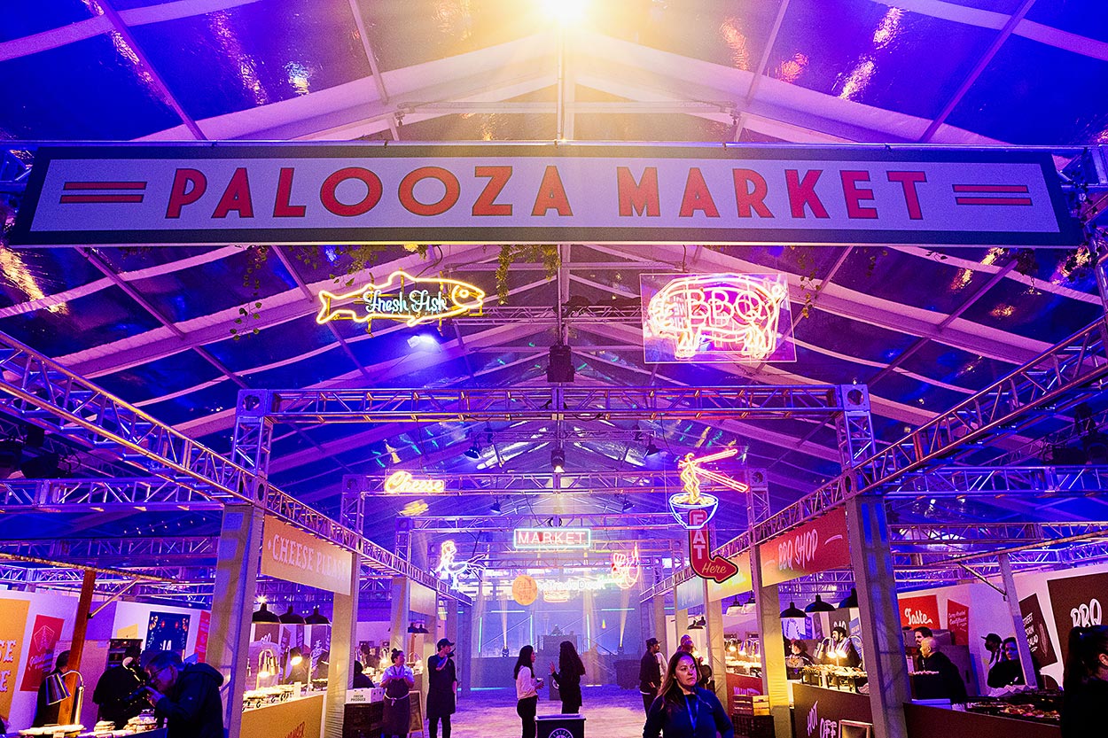 Palooza market signage with neon lights and magenta lighting