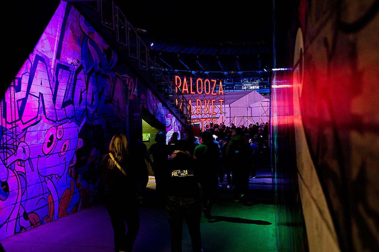 entry way to event with neon Palooza signage in the background