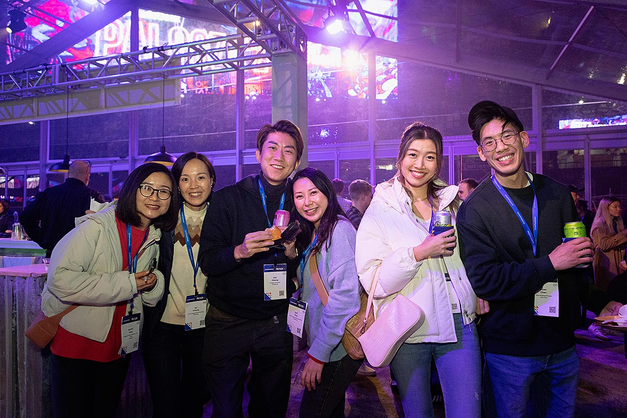 group of six party attendees, night time lighting