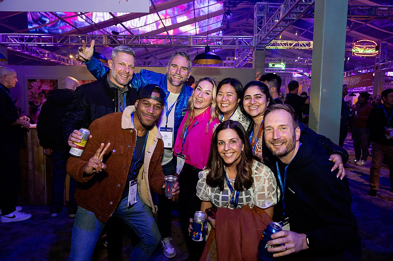 group of 8 smiling guests at event party