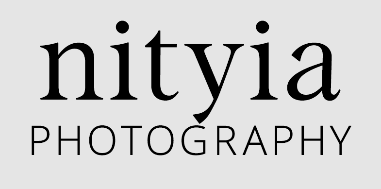 Nityia-LOGO-Black-on-white Logo for Nityia Photography, black writing on light gray background