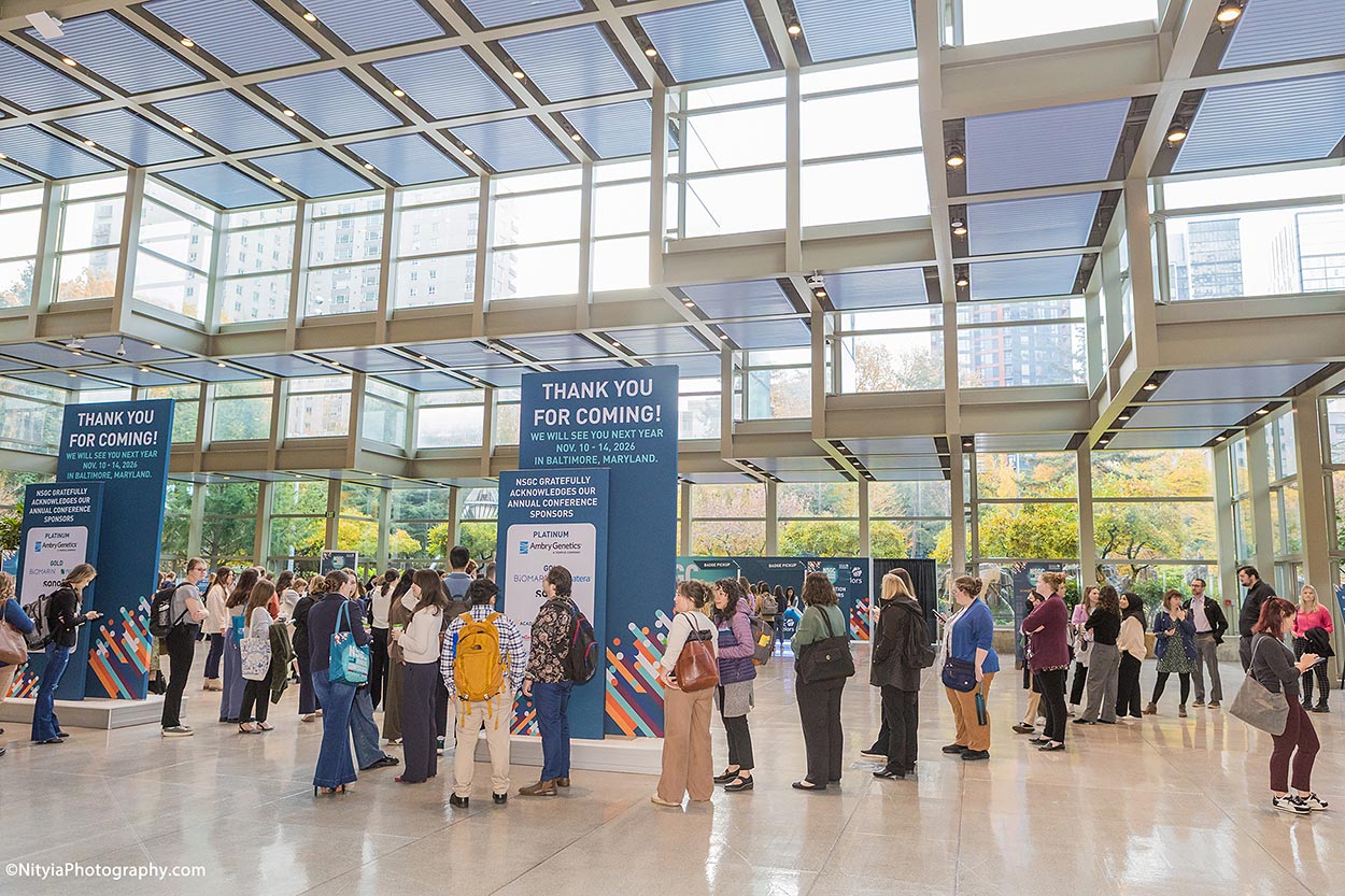 Conference attendees, Seattle Convention Center conference registration line in morning sunlight