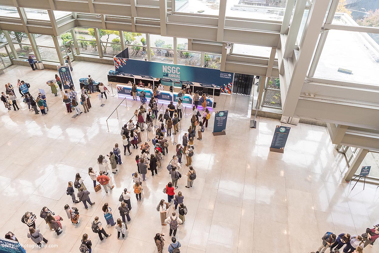 Birds eye view, Seattle Convention Center conference registration line in morning sunlight