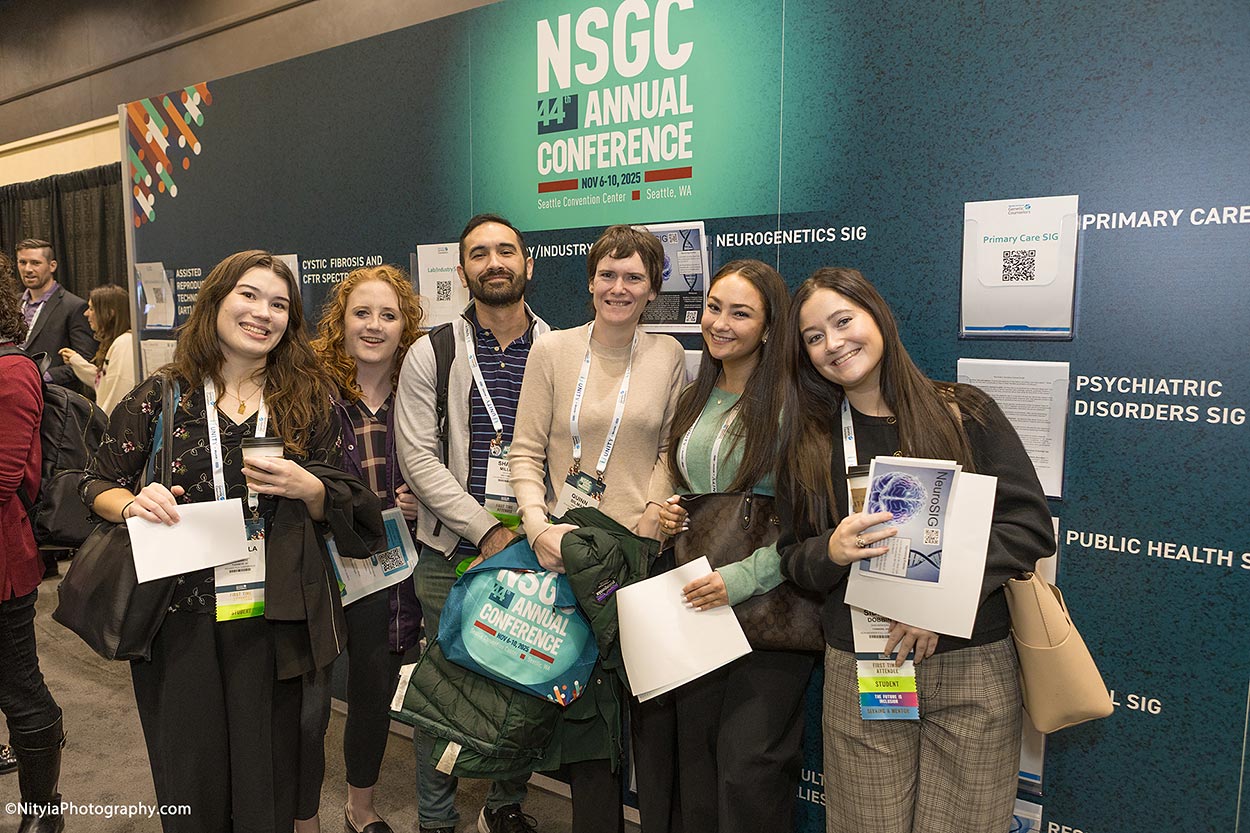 Group of young attendees at Genetics Conference exhibit hall