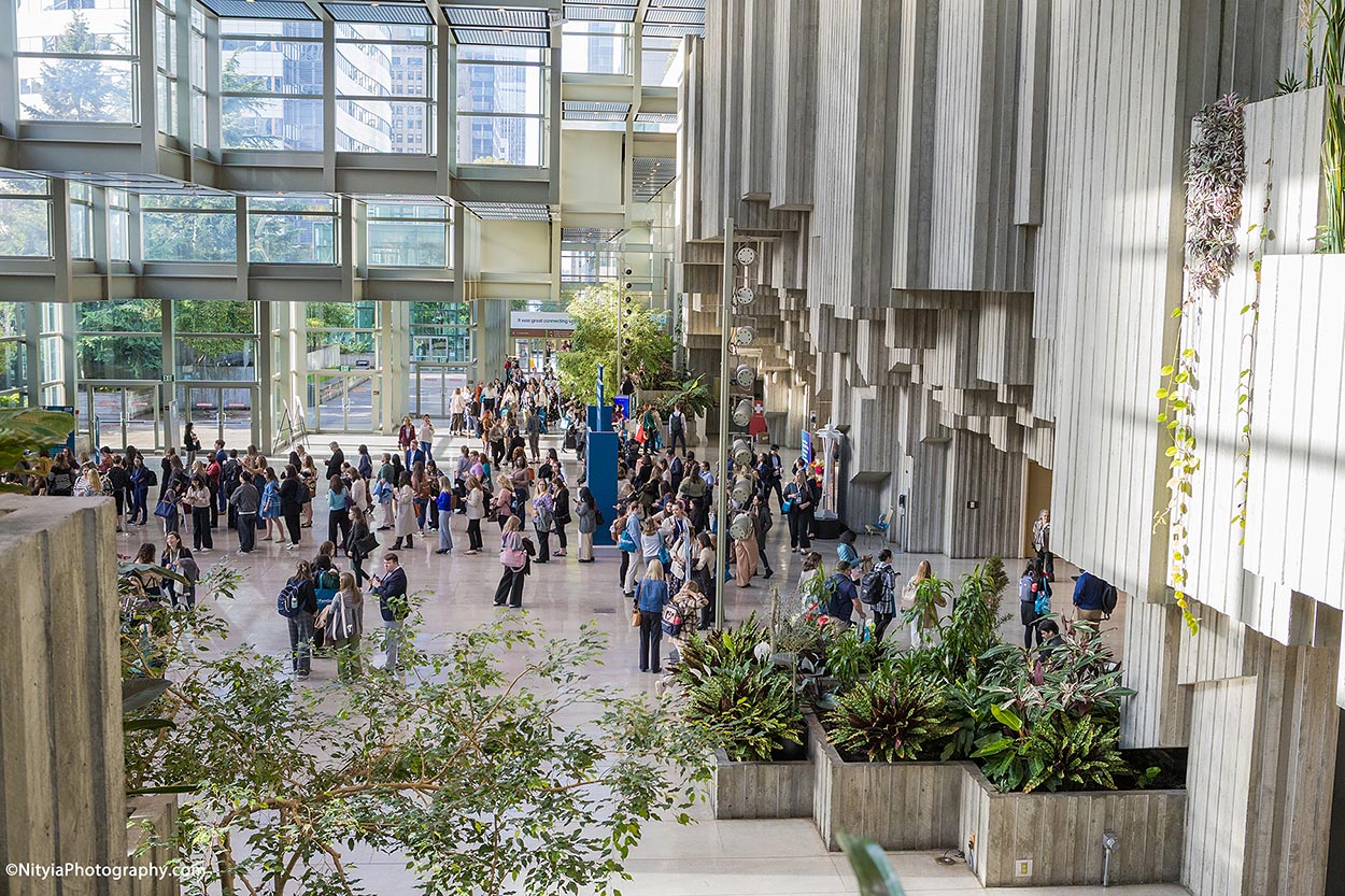 Seattle Convention Center conference registration line in morning sunlight
