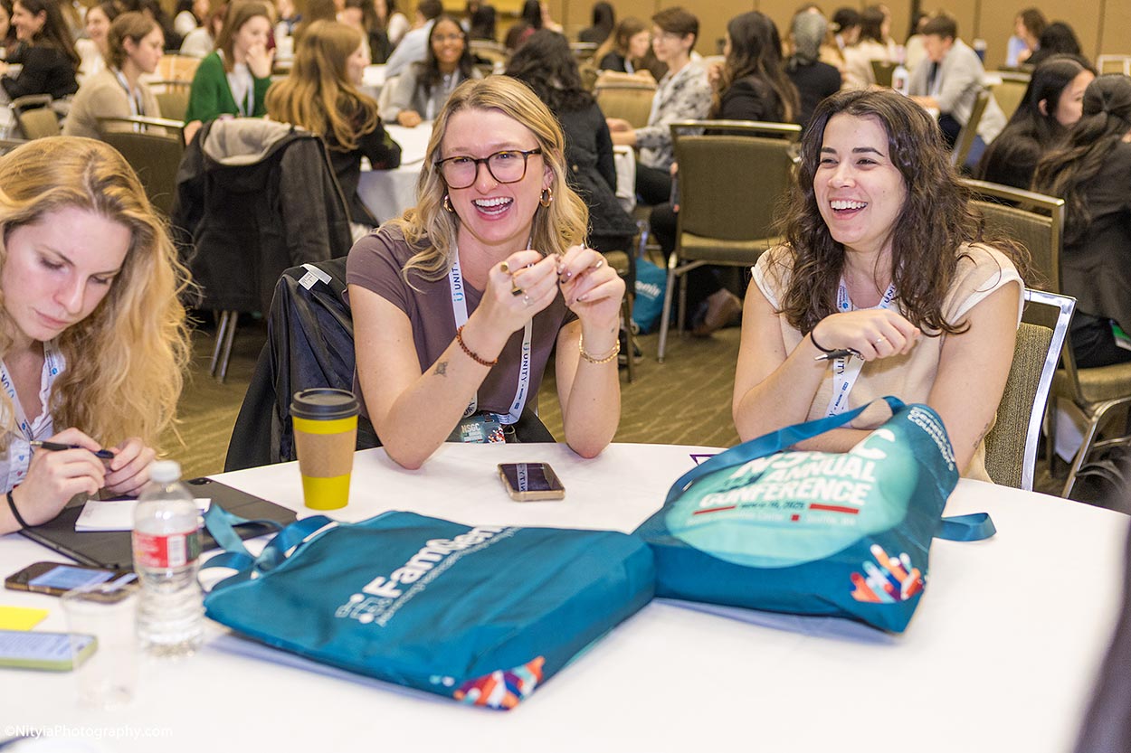 Candid conference photography showing networking and engagement